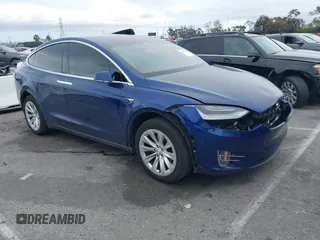 2020 Tesla Model X Long Range with VIN 5YJXCBE29LF283760, listed as a IAAI auction lot 41808754 with 56,216 mi miles. Bid and sale history available at carsss.com. Image 1.