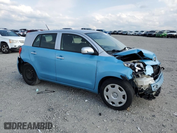 2014 Scion xD with VIN JTKKUPB41E1044556, listed as a Copart auction lot 57123795 with Not provided miles and Salvage title. Bid and sale history available at DreamBid. Image 4.
