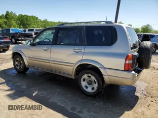 2002 Suzuki XL7 Standard z VIN JS3TY92V524108548, wystawiony jako Copart lot #56304705 z przebiegiem 288 201 mil mil oraz Nie do naprawy • Non repairable. Historia ofert i sprzedaży dostępna na DreamBid. Obrazek 2.