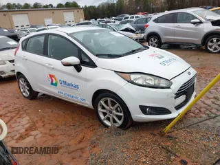 2016 Ford Fiesta SE with VIN 3FADP4EJ2GM157810, listed as a IAAI auction lot 41011326 with 214,609 mi miles. Bid and sale history available at carsss.com. Image 1.