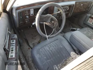1990 Cadillac Brougham z VIN 1G6DW5472LR711206, wystawiony jako Copart lot #75627814 z przebiegiem Nie podano mil oraz Nie do naprawy. Historia ofert i sprzedaży dostępna na DreamBid. Obrazek 8.