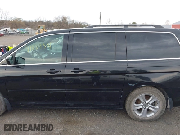 2010 Honda Odyssey Touring with VIN 5FNRL3H95AB040354, listed as a IAAI auction lot 41889501 with 155,069 mi miles. Bid and sale history available at carsss.com. Image 6.