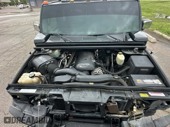 2005 Hummer H2 SUT z VIN 5GRGN22U15H123289, wystawiony jako Copart lot #55254575 z przebiegiem 161 105 mil mil oraz Tytuł czysty. Historia ofert i sprzedaży dostępna na DreamBid. Obrazek 7.