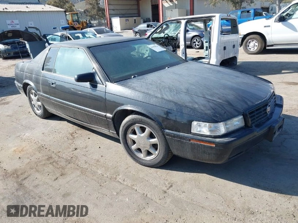 2001 Cadillac Eldorado Touring ETC z VIN 1G6ET12911B103774, wystawiony jako IAAI lot #41998828 z przebiegiem 128 724 mil mil oraz . Historia ofert i sprzedaży dostępna na DreamBid. Obrazek 1.