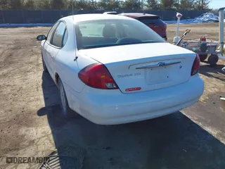 2001 Ford Taurus SES with VIN 1FAFP55231A243171, listed as a IAAI auction lot 41429890 with 131,537 mi miles. Bid and sale history available at carsss.com. Image 3.
