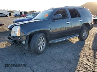 2013 GMC Yukon Denali with VIN 1GKS1EEF0DR205906, listed as a Copart auction lot 87969385 with 128,283 mi miles and Salvage Title. Bid and sale history available at carsss.com. Image 1.