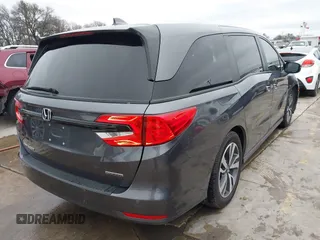 2021 Honda Odyssey Touring with VIN 5FNRL6H86MB021504, listed as a IAAI auction lot 41550040 with 55,068 mi miles. Bid and sale history available at carsss.com. Image 4.