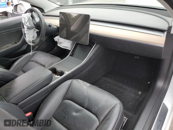 2020 Tesla Model 3 Standard Range Plus with VIN 5YJ3E1EA5LF747010, listed as a Copart auction lot 50937975 with Not Provided miles and Salvage Title. Bid and sale history available at DreamBid. Image 8.
