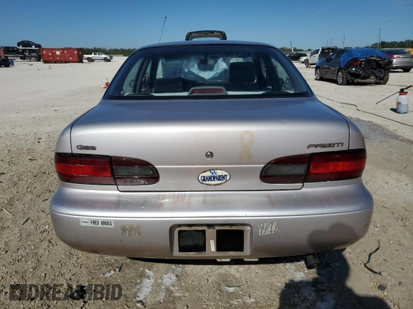 1996 Geo Prizm z VIN 1Y1SK5267TZ068437, wystawiony jako Copart lot #41403285 z przebiegiem 74 727 mil mil oraz Szkody całkowita. Historia ofert i sprzedaży dostępna na DreamBid. Obrazek 6.