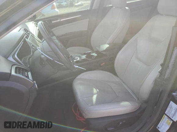 2016 Ford Fusion Titanium with VIN 3FA6P0K98GR319289, listed as a Copart auction lot 77114294 with 123,586 mi miles and Salvage Title. Bid and sale history available at DreamBid. Image 7.