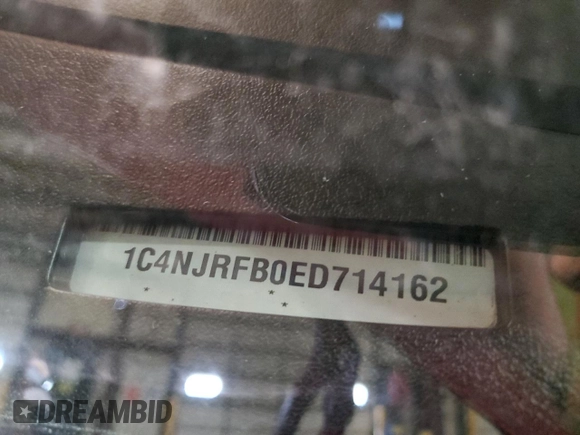 2014 Jeep Patriot Latitude z VIN 1C4NJRFB0ED714162, wystawiony jako Copart lot #55055685 z przebiegiem 122 698 mil mil oraz Szkoda całkowita • Salvage title. Historia ofert i sprzedaży dostępna na DreamBid. Obrazek 13.