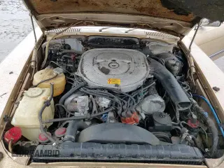 1985 Mercedes-Benz SL z VIN WDBBA45C9FA016084, wystawiony jako Copart lot #86268694 z przebiegiem 94 159 mil mil oraz Czysty tytuł • Clean title. Historia ofert i sprzedaży dostępna na DreamBid. Obrazek 13.