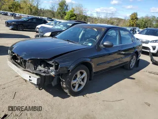 2001 Nissan Maxima SE with VIN JN1CA31D51T804570, listed as a Copart auction lot 75412704 with 84,493 mi miles and Salvage title. Bid and sale history available at DreamBid. Image 1.