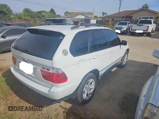 2006 BMW X5 4.4i with VIN 5UXFB53556LV26283, listed as a Copart auction lot 79714584 with 77,033 mi miles and Clean Title. Bid and sale history available at carsss.com. Image 4.