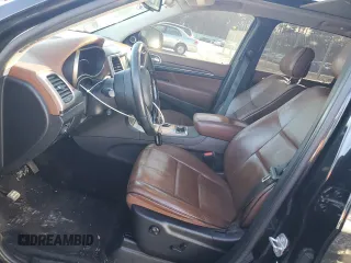 2015 Jeep Grand Cherokee Summit with VIN 1C4RJFJG0FC700014, listed as a Copart auction lot 42981765 with 144,937 mi miles and Salvage Title. Bid and sale history available at DreamBid. Image 7.