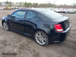 2011 Scion tC with VIN JTKJF5C74B3014552, listed as a IAAI auction lot 42004369 with 232,588 mi miles. Bid and sale history available at carsss.com. Image 3.