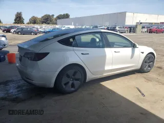 2021 Tesla Model 3 Standard Range Plus z VIN 5YJ3E1EA7MF078241, wystawiony jako Copart lot #57100525 z przebiegiem 56 700 mil mil oraz Szkoda całkowita • Salvage title. Historia ofert i sprzedaży dostępna na DreamBid. Obrazek 3.