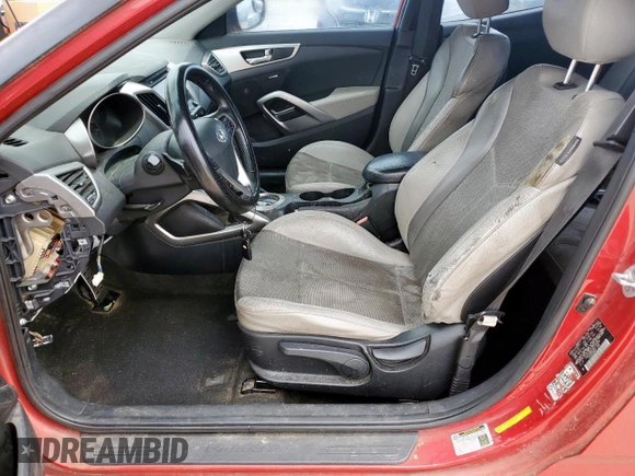 2013 Hyundai Veloster w/Gray Int z VIN KMHTC6AD7DU142655, wystawiony jako Copart lot #56233005 z przebiegiem 181 297 mil mil oraz Czysty tytuł • Clean title. Historia ofert i sprzedaży dostępna na DreamBid. Obrazek 7.