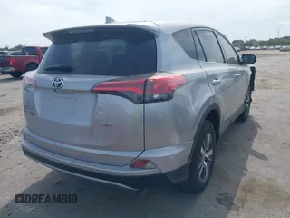 2018 Toyota RAV4 XLE z VIN 2T3WFREV5JW466294, wystawiony jako IAAI lot #41841436 z przebiegiem 132 150 mil mil oraz . Historia ofert i sprzedaży dostępna na DreamBid. Obrazek 4.
