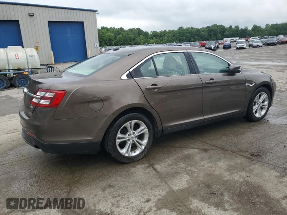 2015 Ford Taurus SEL z VIN 1FAHP2E84FG102075, wystawiony jako Copart lot #59740265 z przebiegiem 90 669 mil mil oraz Szkoda całkowita • Salvage title. Historia ofert i sprzedaży dostępna na DreamBid. Obrazek 3.