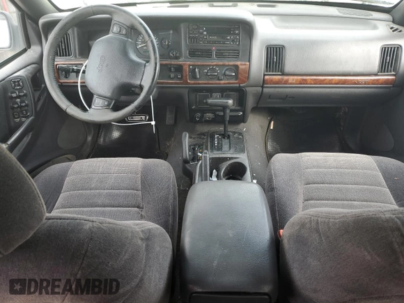 1997 Jeep Grand Cherokee Laredo with VIN 1J4GZ58S2VC676652, listed as a Copart auction lot 64939974 with 256,923 mi miles and Salvage Title. Bid and sale history available at carsss.com. Image 8.