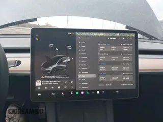 2023 Tesla Model 3 with VIN 5YJ3E1EAXPF693693, listed as a IAAI auction lot 41709704 with 12,473 mi miles and . Bid and sale history available at DreamBid. Image 18.