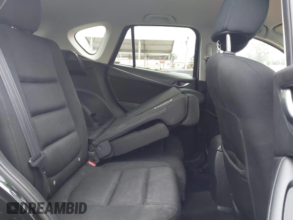 2014 Mazda CX-5 Touring z VIN JM3KE2CY3E0355332, wystawiony jako IAAI lot #42096306 z przebiegiem 108 198 mil mil oraz . Historia ofert i sprzedaży dostępna na DreamBid. Obrazek 8.