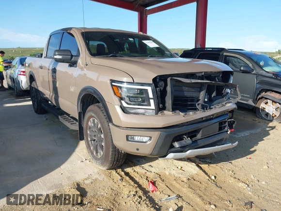 2021 Nissan Titan SV with VIN 1N6AA1ED1MN523973, listed as a IAAI auction lot 42406382 with 73,688 mi miles and . Bid and sale history available at DreamBid. Image 1.