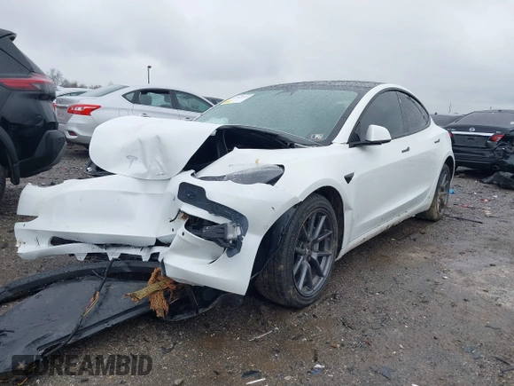 2022 Tesla Model 3 Long Range with VIN 5YJ3E1EB0NF129945, listed as a IAAI auction lot 41965531 with 59,162 mi miles and . Bid and sale history available at DreamBid. Image 6.