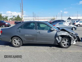 2005 Toyota Camry LE with VIN 4T1BF32K25U603812, listed as a IAAI auction lot 41740671 with 242,316 mi miles and . Bid and sale history available at DreamBid. Image 14.