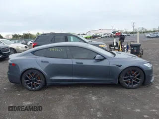 2021 Tesla Model S Long Range with VIN 5YJSA1E5XMF428519, listed as a IAAI auction lot 41926242 with 54,284 mi miles and . Bid and sale history available at DreamBid. Image 13.