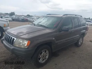 2002 Jeep Grand Cherokee Laredo with VIN 1J4GX48S32C168105, listed as a IAAI auction lot 42451373 with 293,790 mi miles and . Bid and sale history available at DreamBid. Image 2.