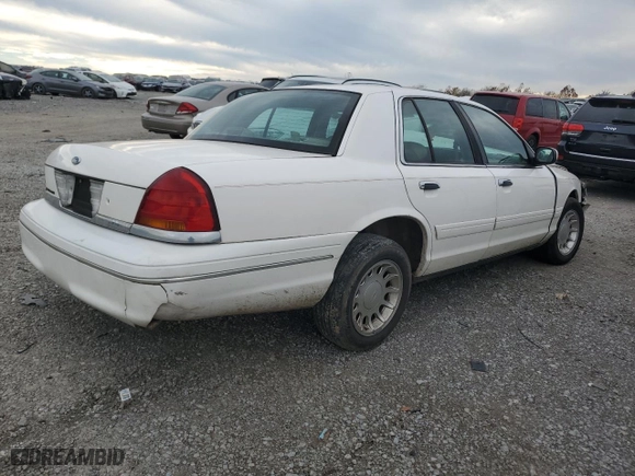 2000 Ford Crown Victoria LX with VIN 2FAFP74W4YX120352, listed as a Copart auction lot 79833264 with 0 mi miles and Salvage Title. Bid and sale history available at carsss.com. Image 3.