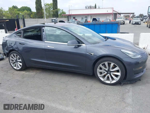 2018 Tesla Model 3 Long Range Battery with VIN 5YJ3E1EA8JF059385, listed as a IAAI auction lot 42116589 with 63,630 mi miles and . Bid and sale history available at DreamBid. Image 14.