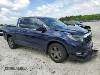 2023 Honda Ridgeline RTL-E with VIN 5FPYK3F74PB037333, listed as a Copart auction lot 56209715 with 36,041 mi miles and Salvage title. Bid and sale history available at DreamBid. Image 4.