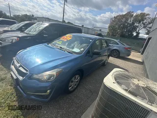 2016 Subaru Impreza z VIN JF1GJAA64GH004932, wystawiony jako Copart lot #87751265 z przebiegiem 99 587 mil mil oraz Czysty tytuł • Clean title. Historia ofert i sprzedaży dostępna na DreamBid. Obrazek 2.