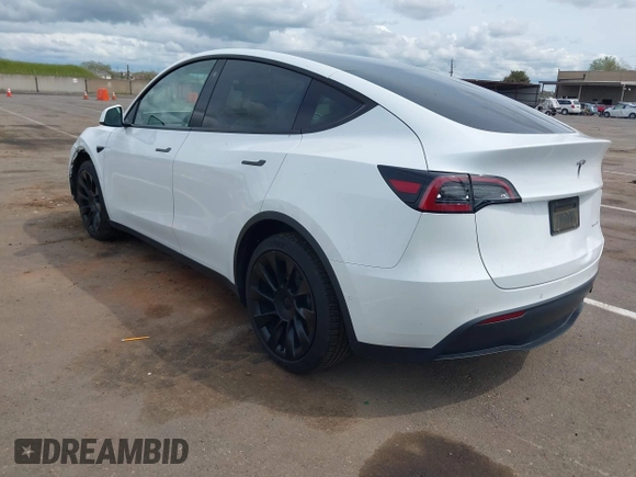 2022 Tesla Model Y Long Range with VIN 7SAYGDEE2NF403354, listed as a IAAI auction lot 41986216 with 53,177 mi miles and . Bid and sale history available at DreamBid. Image 3.