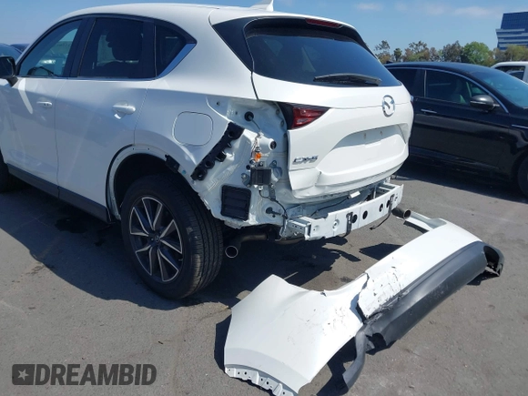 2018 Mazda CX-5 Touring with VIN JM3KFACM0J0416716, listed as a IAAI auction lot 42150121 with 61,332 mi miles and . Bid and sale history available at carsss.com. Image 6.