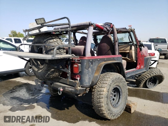 1999 Jeep Wrangler Sport with VIN 1J4FY19S5XP493117, listed as a Copart auction lot 57490792 with Not provided miles and Salvage title. Bid and sale history available at DreamBid. Image 4.