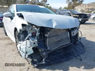 2023 Toyota Camry SE with VIN 4T1T11AK8PU138805, listed as a IAAI auction lot 41977827 with 19,661 mi miles and . Bid and sale history available at DreamBid. Image 6.