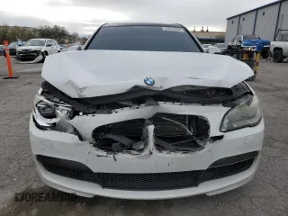 2013 BMW 7 Series 740i with VIN WBAYA6C55DC995290, listed as a Copart auction lot 82022284 with 128,882 mi miles and Salvage Title. Bid and sale history available at carsss.com. Image 5.
