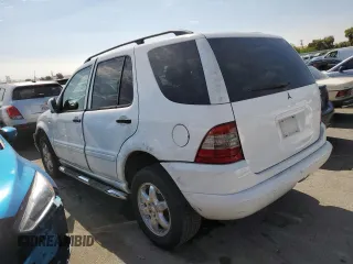 2000 Mercedes-Benz M-Class with VIN 4JGAB54E5YA165660, listed as a Copart auction lot 65872364 with 115,668 mi miles and Salvage Title. Bid and sale history available at carsss.com. Image 2.