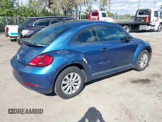 2018 Volkswagen Beetle S with VIN 3VWFD7AT9JM712664, listed as a IAAI auction lot 41634663 with 72,649 mi miles. Bid and sale history available at carsss.com. Image 4.