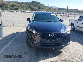 2014 Mazda CX-5 Grand Touring with VIN JM3KE2DY7E0376389, listed as a IAAI auction lot 42014946 with 126,081 mi miles. Bid and sale history available at carsss.com. Image 12.