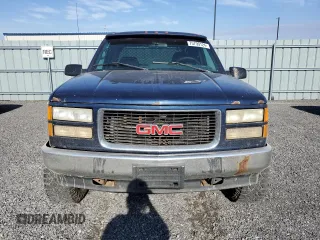 1995 GMC Sierra 1500 z VIN 2GTEK19K3S1591653, wystawiony jako Copart lot #75799124 z przebiegiem 329 311 mil mil oraz Nie do naprawy. Historia ofert i sprzedaży dostępna na DreamBid. Obrazek 5.