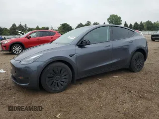 2023 Tesla Model Y Long Range z VIN 7SAYGDEE0PF889214, wystawiony jako Copart lot #57597625 z przebiegiem 9 281 mil mil oraz Szkoda całkowita • Salvage title. Historia ofert i sprzedaży dostępna na DreamBid. Obrazek 1.