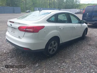 2017 Ford Focus SE with VIN 1FADP3FEXHL233966, listed as a IAAI auction lot 42220832 with 70,197 mi miles and . Bid and sale history available at carsss.com. Image 4.