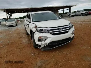 2017 Honda Pilot Touring z VIN 5FNYF6H92HB067140, wystawiony jako Copart lot #55757925 z przebiegiem 132 425 mil mil oraz Szkoda całkowita • Salvage title. Historia ofert i sprzedaży dostępna na DreamBid. Obrazek 14.