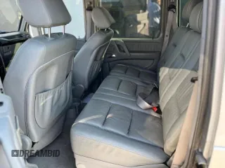 2002 Mercedes-Benz G-Class with VIN WDCYR49EX2X128555, listed as a Copart auction lot 77047164 with 222,979 mi miles and Salvage Title. Bid and sale history available at carsss.com. Image 6.