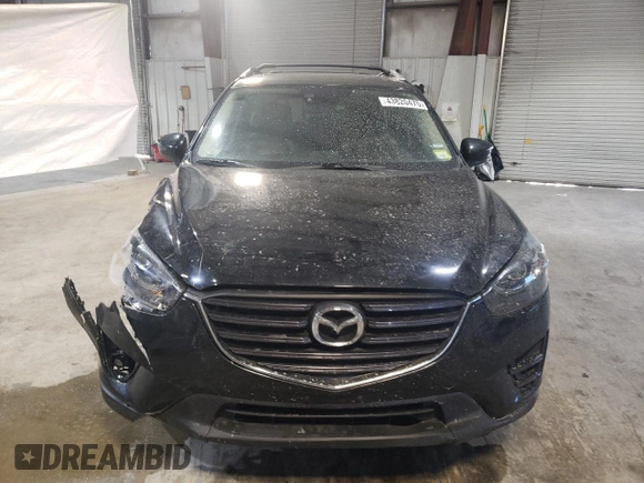 2016 Mazda CX-5 Grand Touring with VIN JM3KE4DY6G0655802, listed as a Copart auction lot 43820475 with 76,639 mi miles and Salvage Title. Bid and sale history available at carsss.com. Image 5.